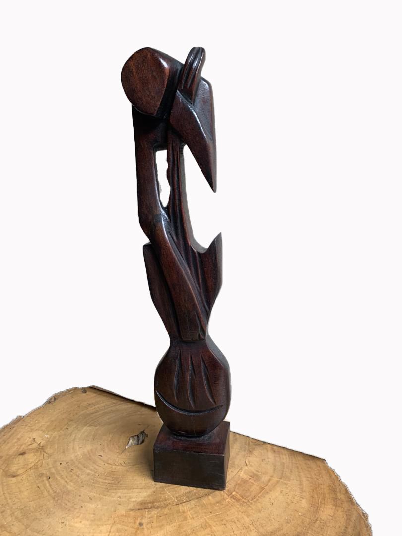 The Melodic Muse: A Carved Guitarist