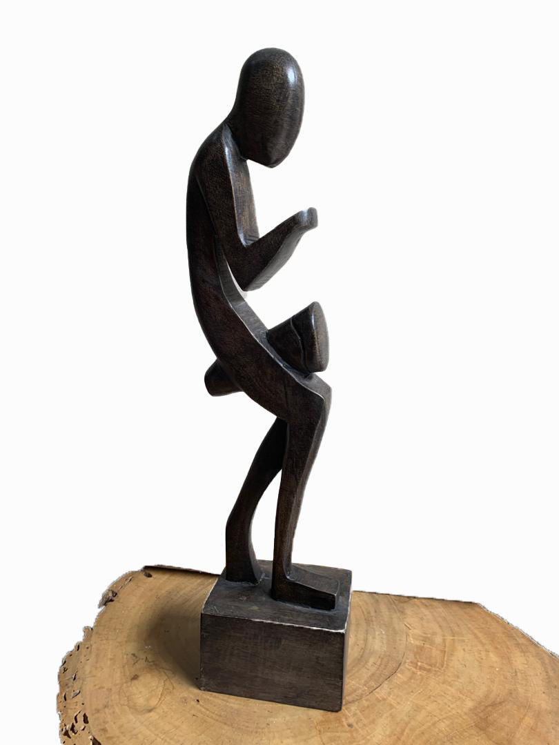 Hand - carved wooden drummer